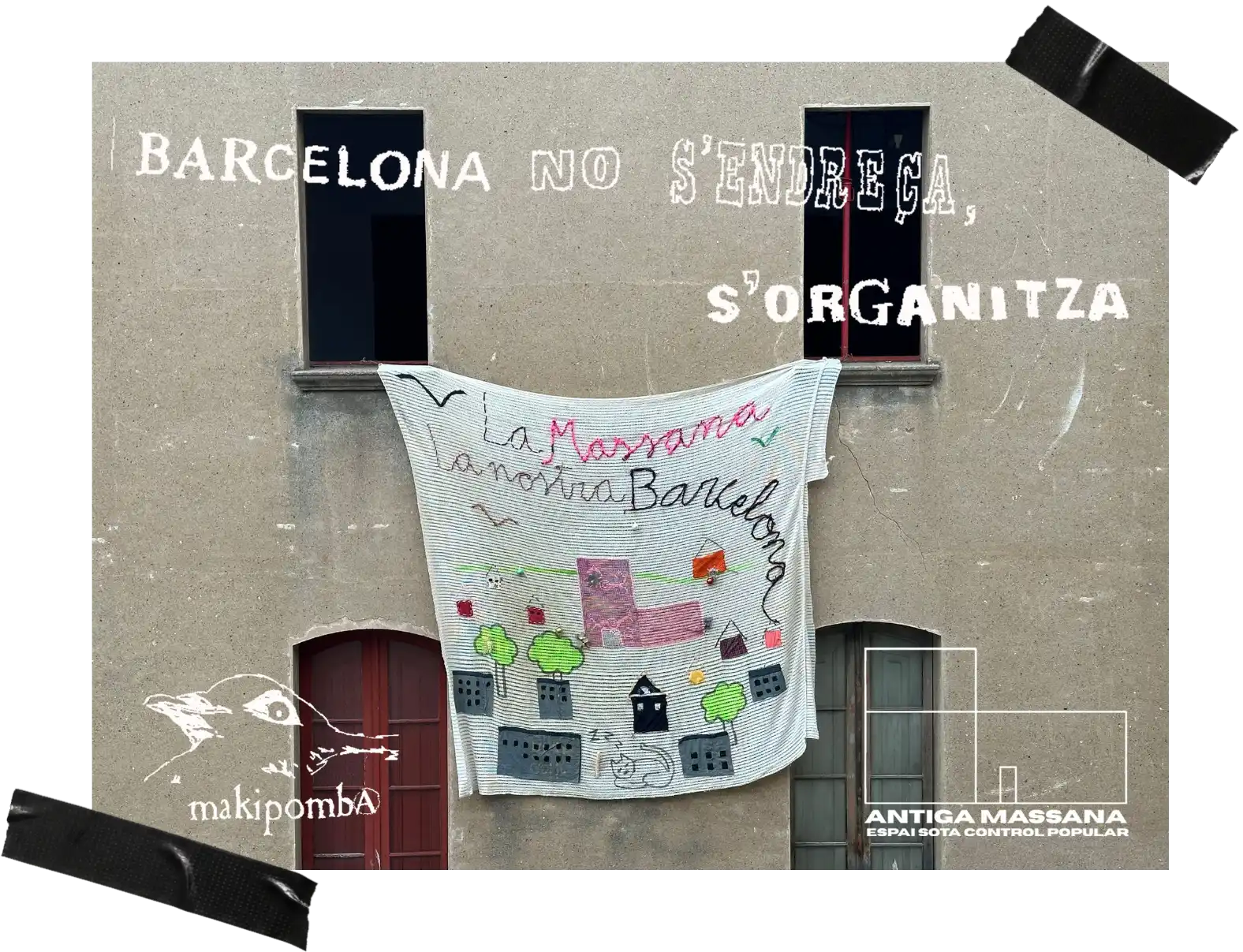 Pancarta tèxtil penjada des de dues finestres de l'Antiga Massana